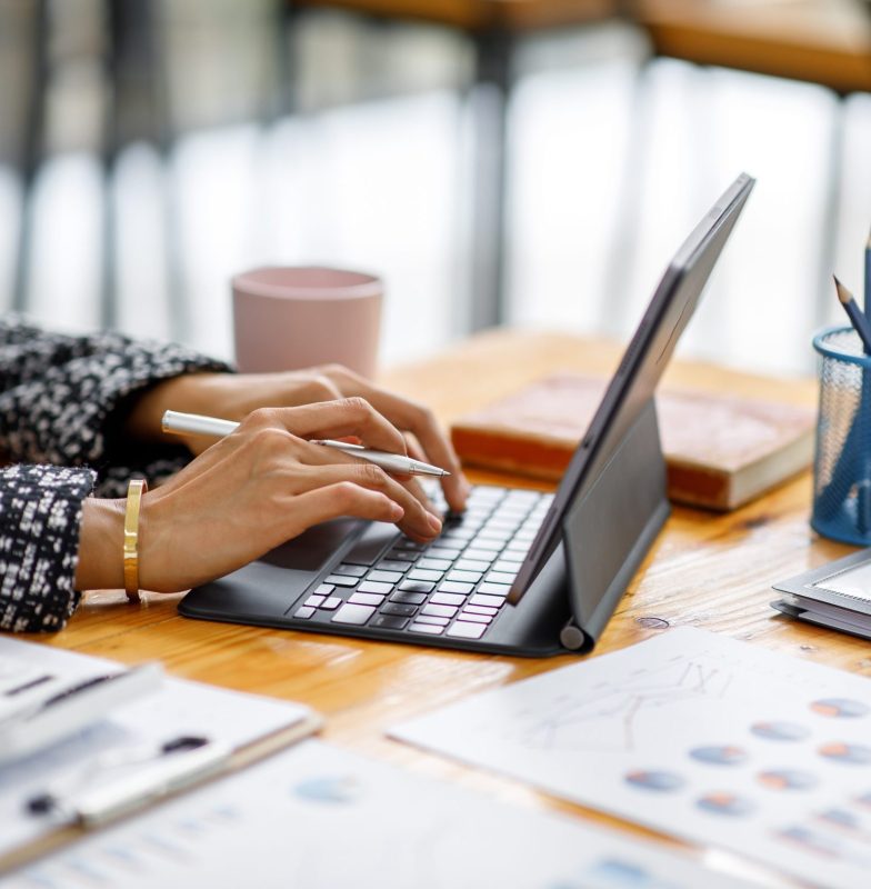 Businesswoman working at office with documents on his desk, doin